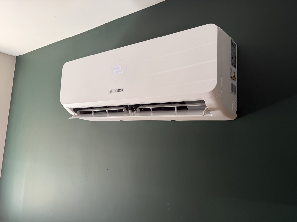 Wall-mounted air conditioning unit installed indoors