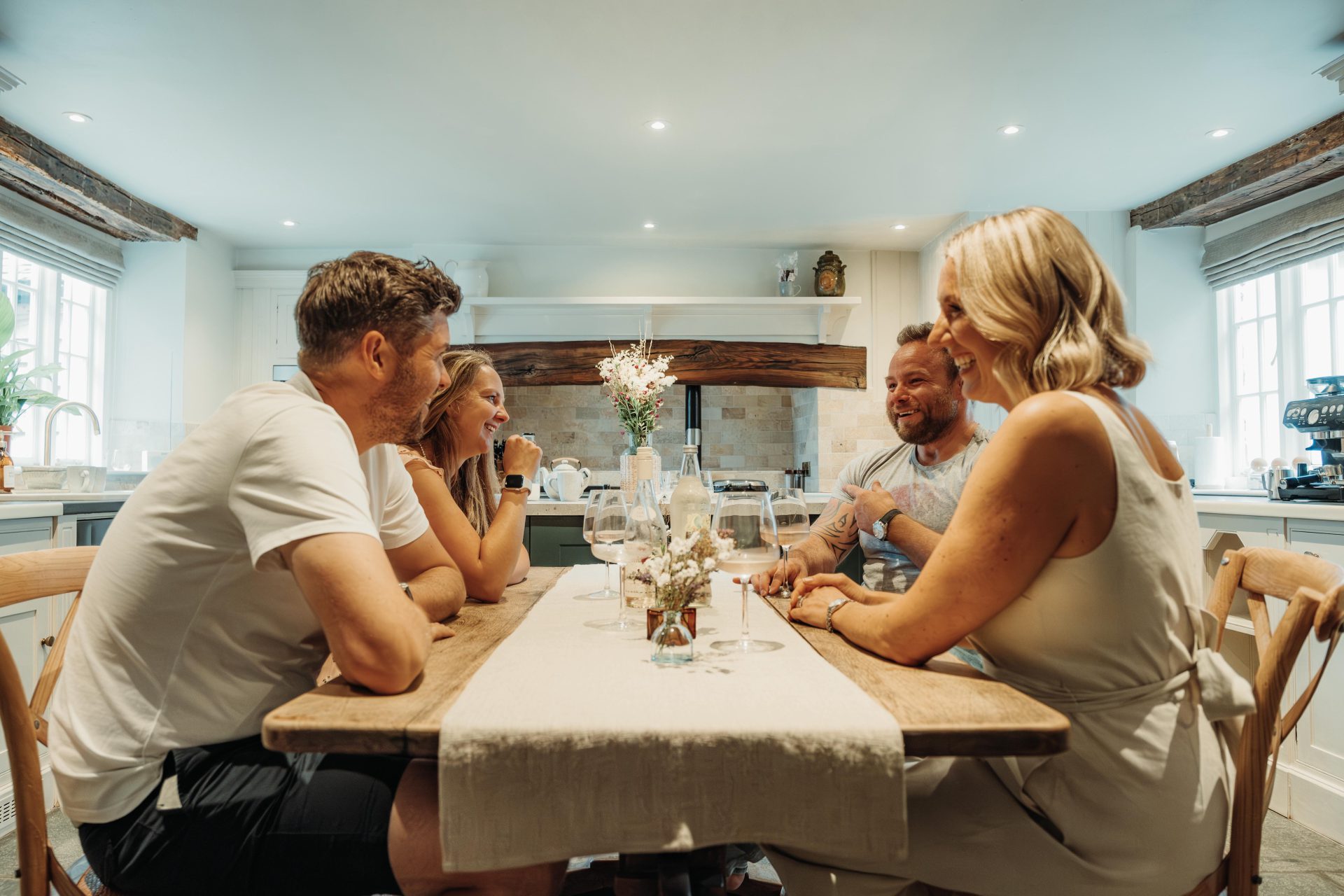 Guests gathered in a clean holiday let kitchen